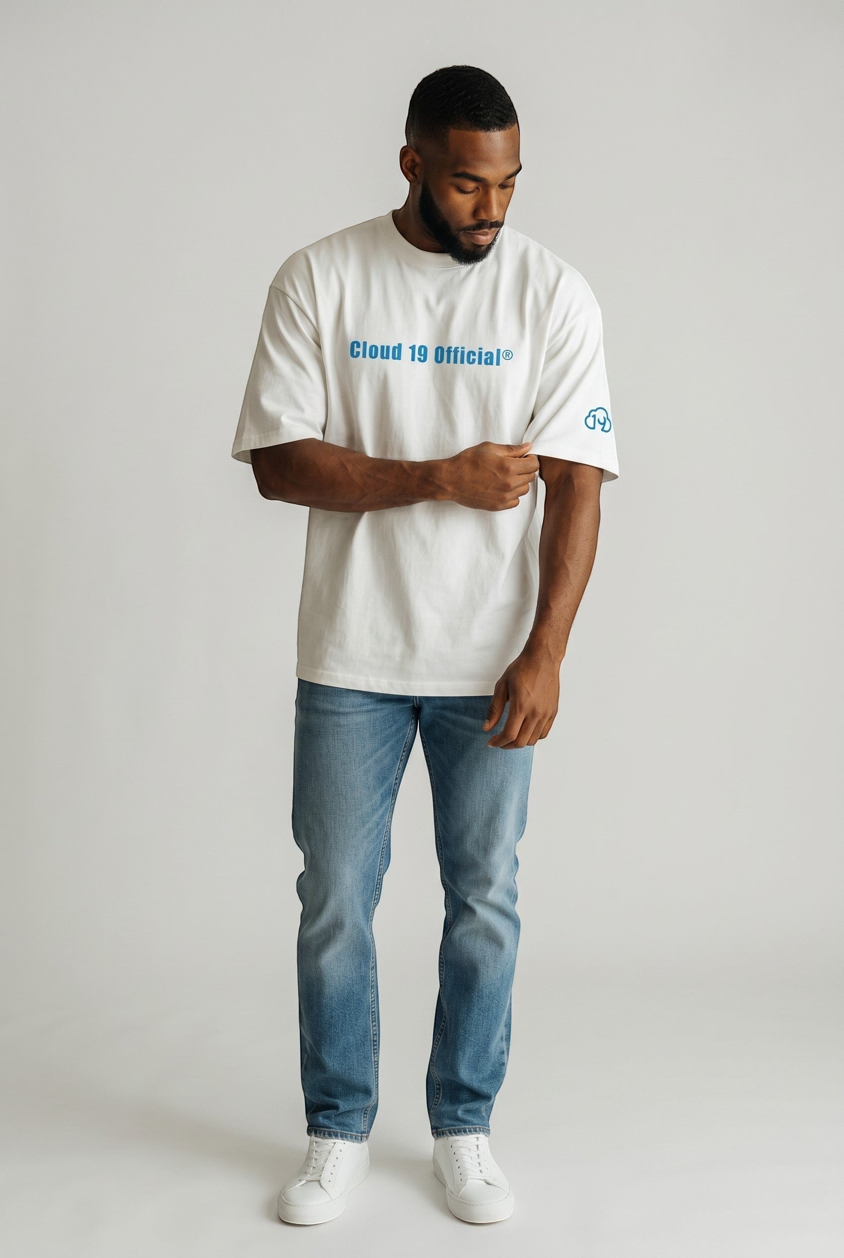 Cloud 19 Official Streetwear Malaysia limited edition oversized white 100% cotton t-shirt with blue logo on chest and sleeve.